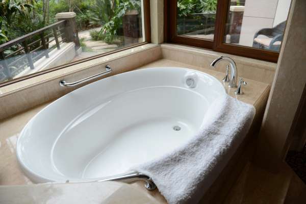 Apply And Tub Cleaner To The Interior Of The Bathtub