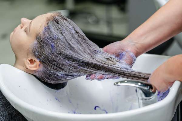 Applying Purple Shampoo